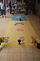 Colored sawdust art on the floor of the library/museum