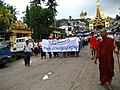 Image 27Protesters in Yangon with a banner that reads non-violence: national movement in Burmese, in the background is Shwedagon Pagoda. (from History of Myanmar)