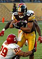 Hines Ward attempts to break an opponent's tackle