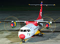 top view, at night, props spinning, colorful Danish Air Transport