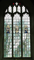 A leadlight window (18th-century-style) set with salvaged remnants of ancient stained glass. England