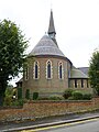 Holy Trinity Church, Lyonsdown Road, New Barnet, London, 1865 by Ewan Christian, showing the strong chancel apse in stock brick with red brick banding[154]