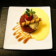 A syrup sponge pudding dessert with a biscuit roll from England