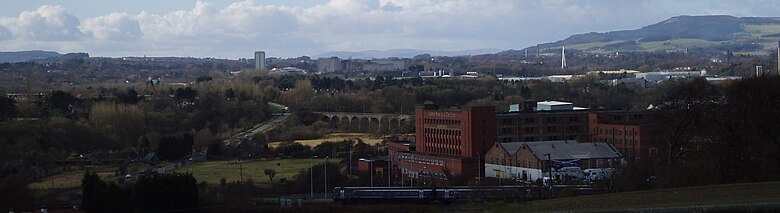 View looking towards Glenrothes from elevated site at St Drostan's Cemetery near Markinch with a view of the town centre skyline, approach roads and railway viaducts