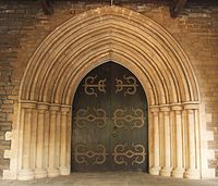 Buff-coloured basalt and limestone doorway to the CNI Afghan Church.[170]