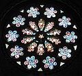 The rose window in the south transept, produced by Hardman & Co.
