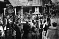 Image 16Men of various ethnicities - Chinese, Malay, and Indian gather at a street corner in Singapore, circa 1900. (from Singaporeans)