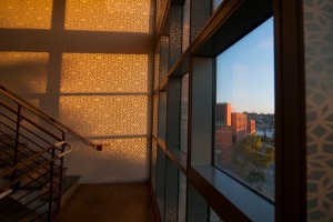 Sun strems through patterned glass at the Physics/Astronomy building. Photo by Katherine B. Turner