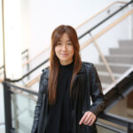 a person stands in front of a stairwell