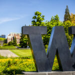 Bronze 'W' statue in front of the University of Washington campus.