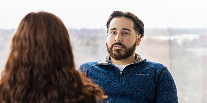 UWM counselor talking with a student