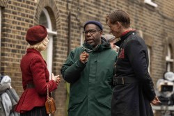 (L_R) Saoirse Ronan, Steve McQueen on the set of Blitz. Credit Apple TV+