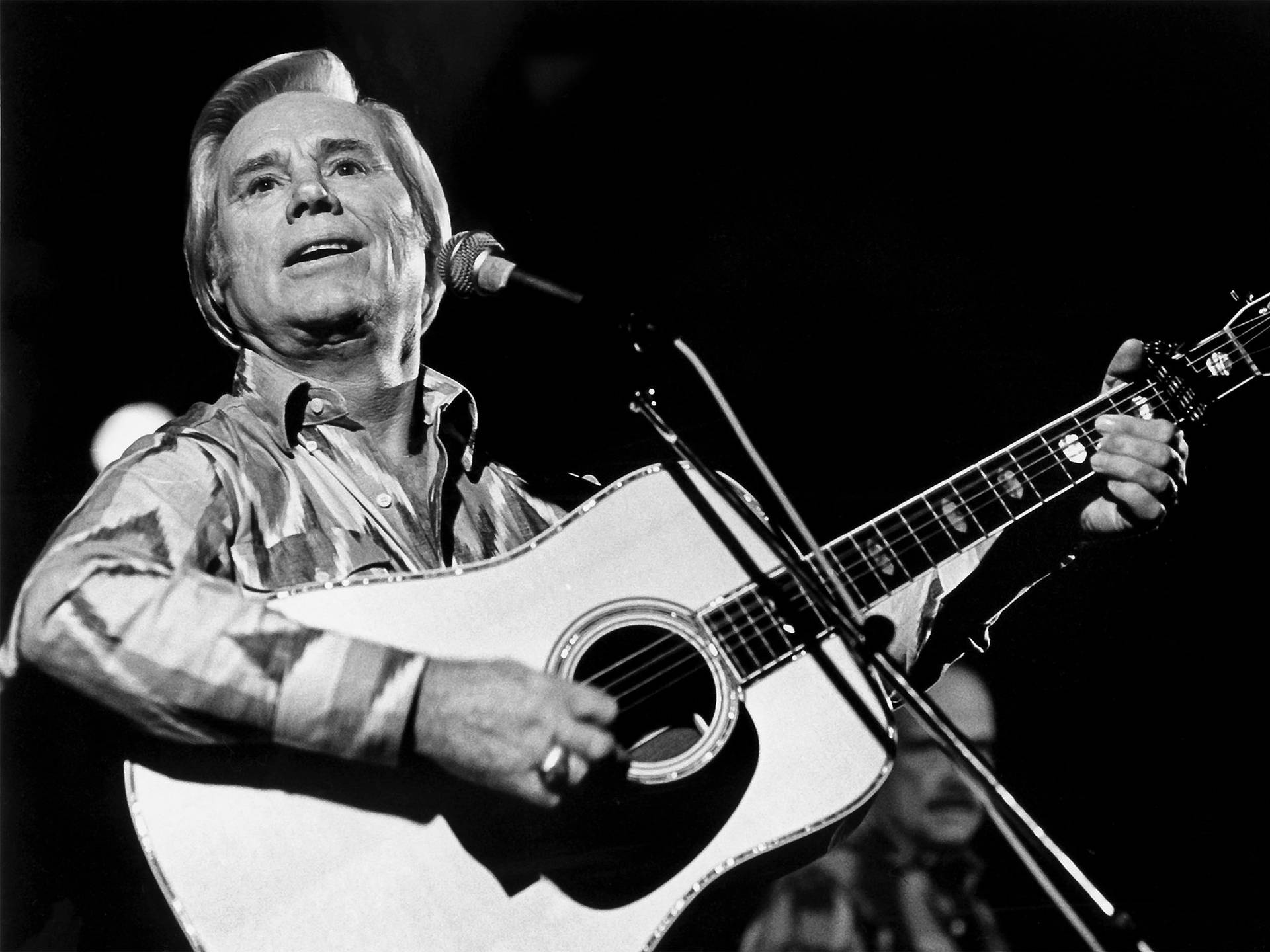 George Jones Playing Guitar Concert Photography Wallpaper