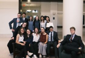 Group of smiling students in business attire