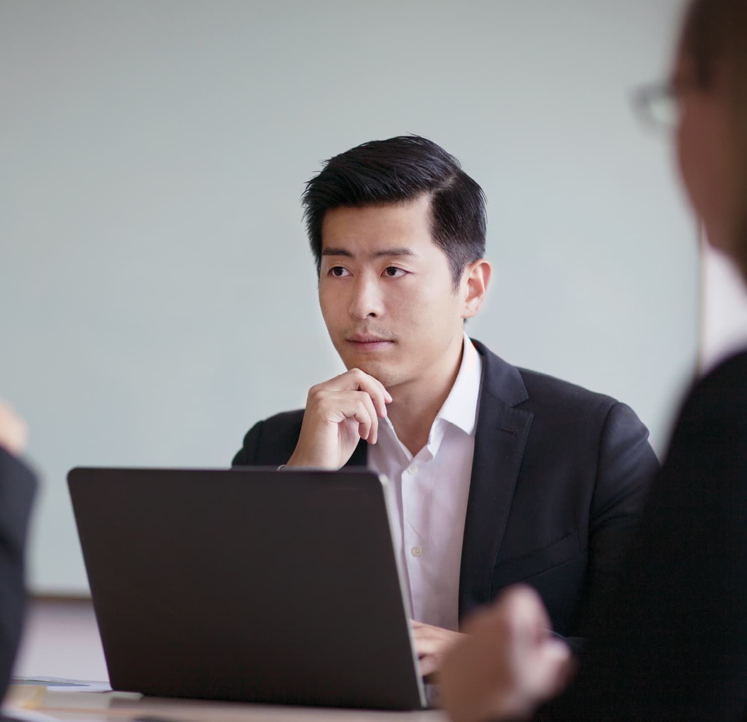 Man sitting in front of laptop