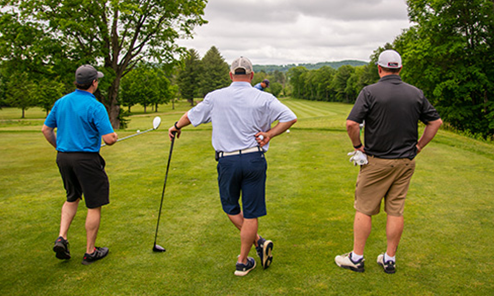 Four men golfing