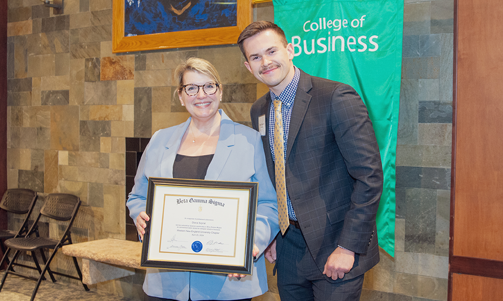 Springfield Regional Chamber of Commerce President Diana Szynal stands with WNE Beta Gamma Sigma Chapter President