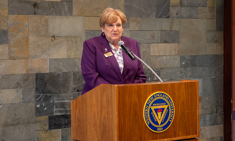 College of Business Dean Sharianne Walker addressing students, faculty, and guests at the Senior Award Ceremony. 