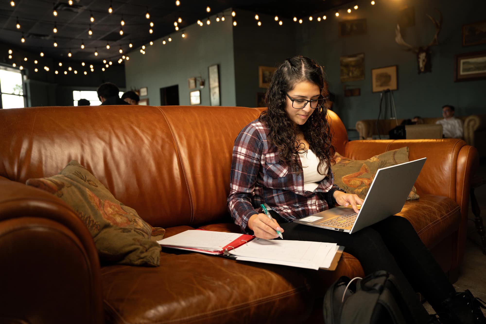 Woman using a laptop on a couch