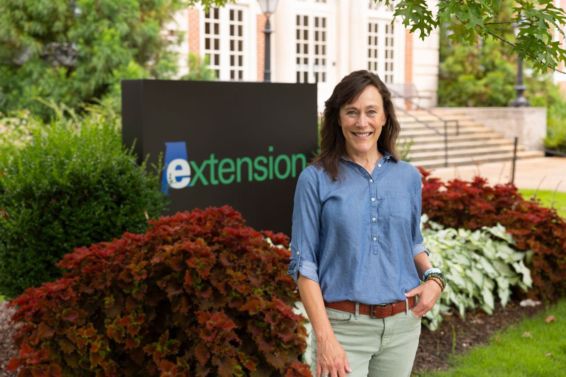 Eve Brantley standing in front of Duncan Hall.