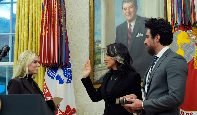 Attorney General Pam Bondi swears in Tulsi Gabbard ias the Director of National Intelligence in the Oval Office of the White House, Wednesday, Feb. 12, 2025, in Washington as her husband Abraham Williams holds the Bible. (Photo/Alex Brandon)