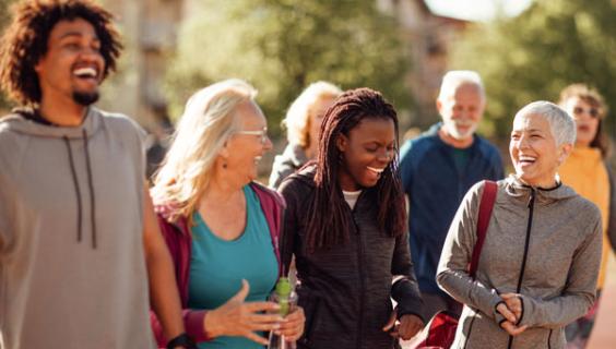 Group of adults laughing together outside