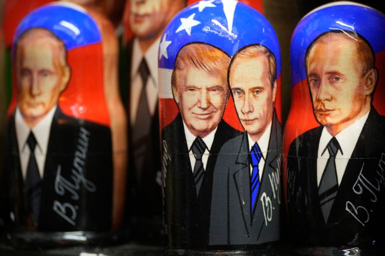 Traditional Russian wooden dolls, called Matryoshka, depicting Republican presidential nominee an former US President Donald Trump, center left, and Russian President Vladimir Putin are displayed for sale at a souvenir shop in St. Petersburg, Russia, Tuesday, Nov. 5, 2024. (AP Photo/Dmitri Lovetsky)