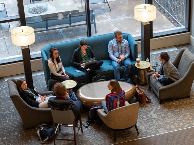 A group of people sitting around a table