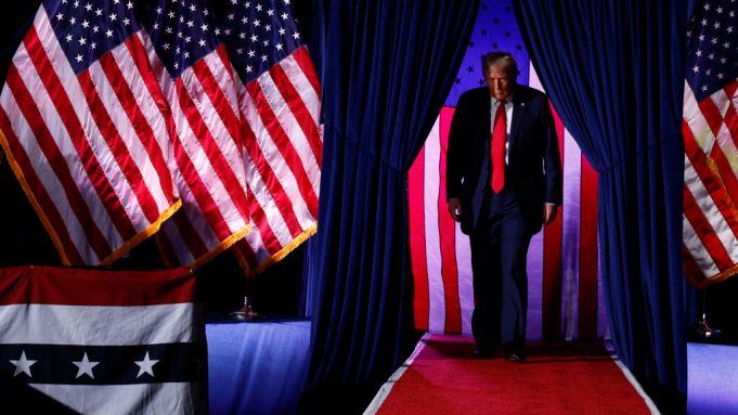 GRAND RAPIDS, MICHIGAN - NOVEMBER 05: Republican presidential nominee, former U.S. President Donald Trump, takes the stage for his last rally of the election year at Van Andel Arena on November 05, 2024 in Grand Rapids, Michigan. Trump campaigned for re-election in the battleground states of North Carolina and Pennsylvania before arriving for his last rally minutes after midnight in Michigan. (Photo by Chip Somodevilla/Getty Images)