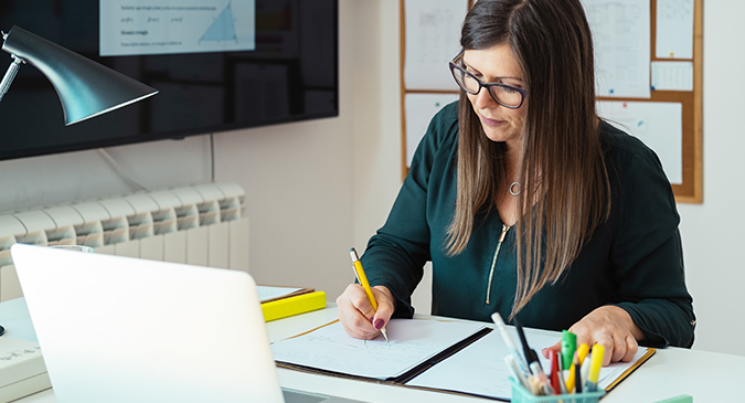 Woman writing in notebook