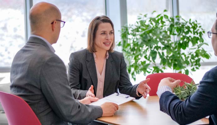 Three professionals meeting and networking