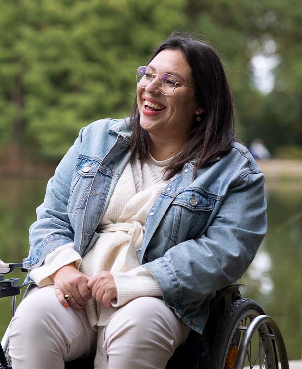 Kim sitting outside on a dock