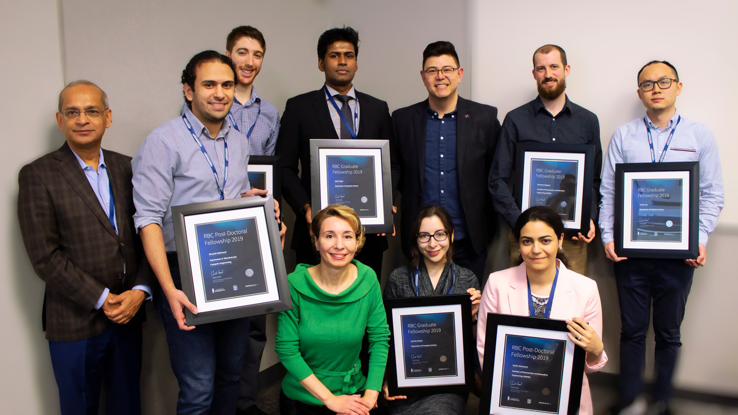 Eirene Seiradaki and the Borealis AI Fellowship Candidates receiving a certificate.