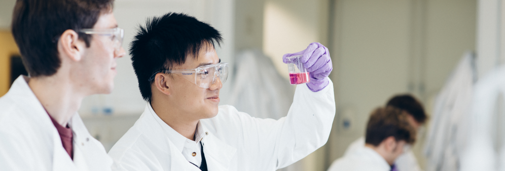 Two male students in Biochemistry lab.