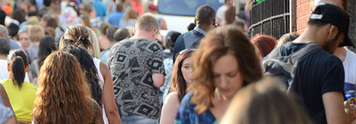 crowd of people walking in the street