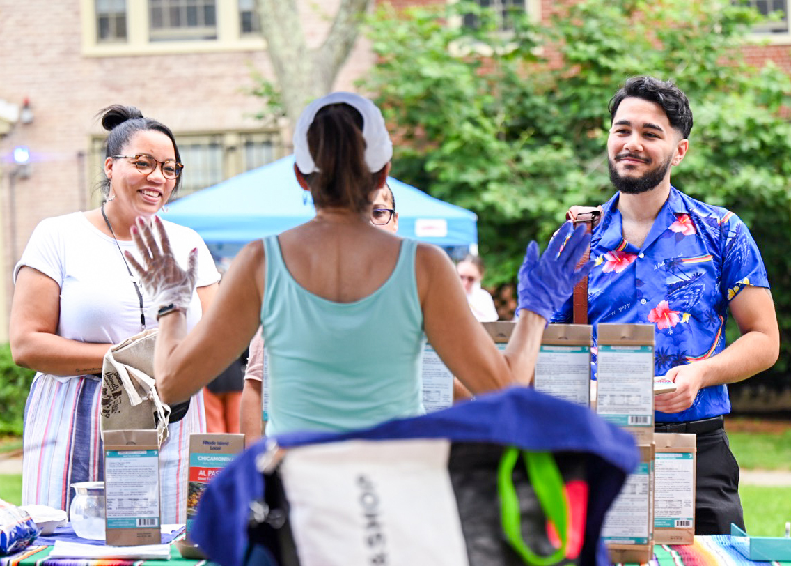 Brown employees engage in conversation on campus