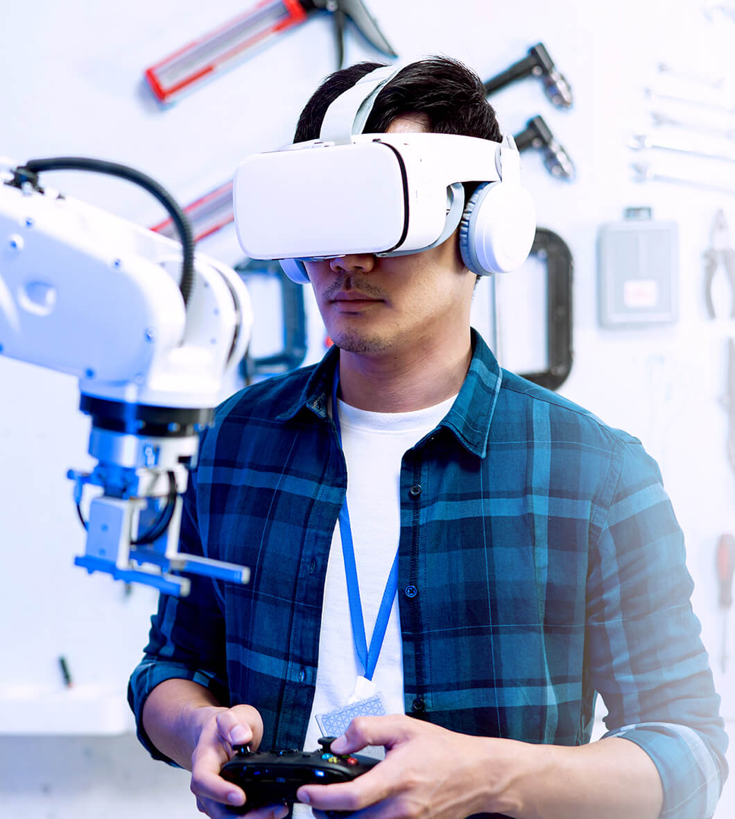 Man wearing VR headset controlling a robot