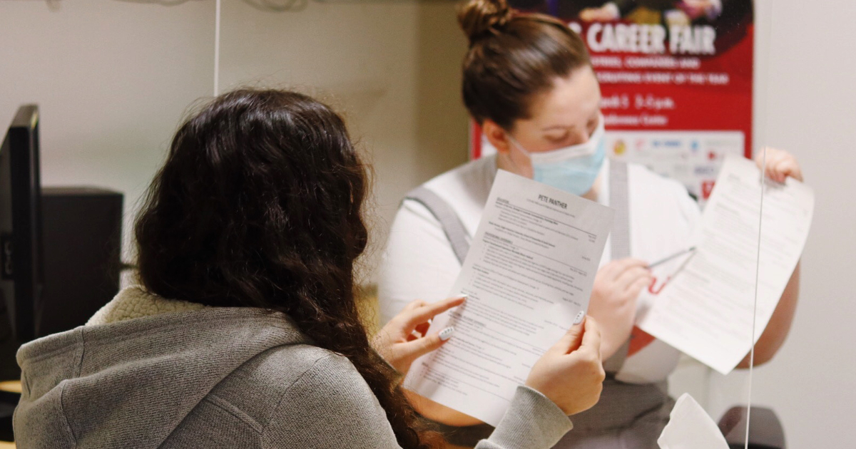 student reviewing resume at career appointment 