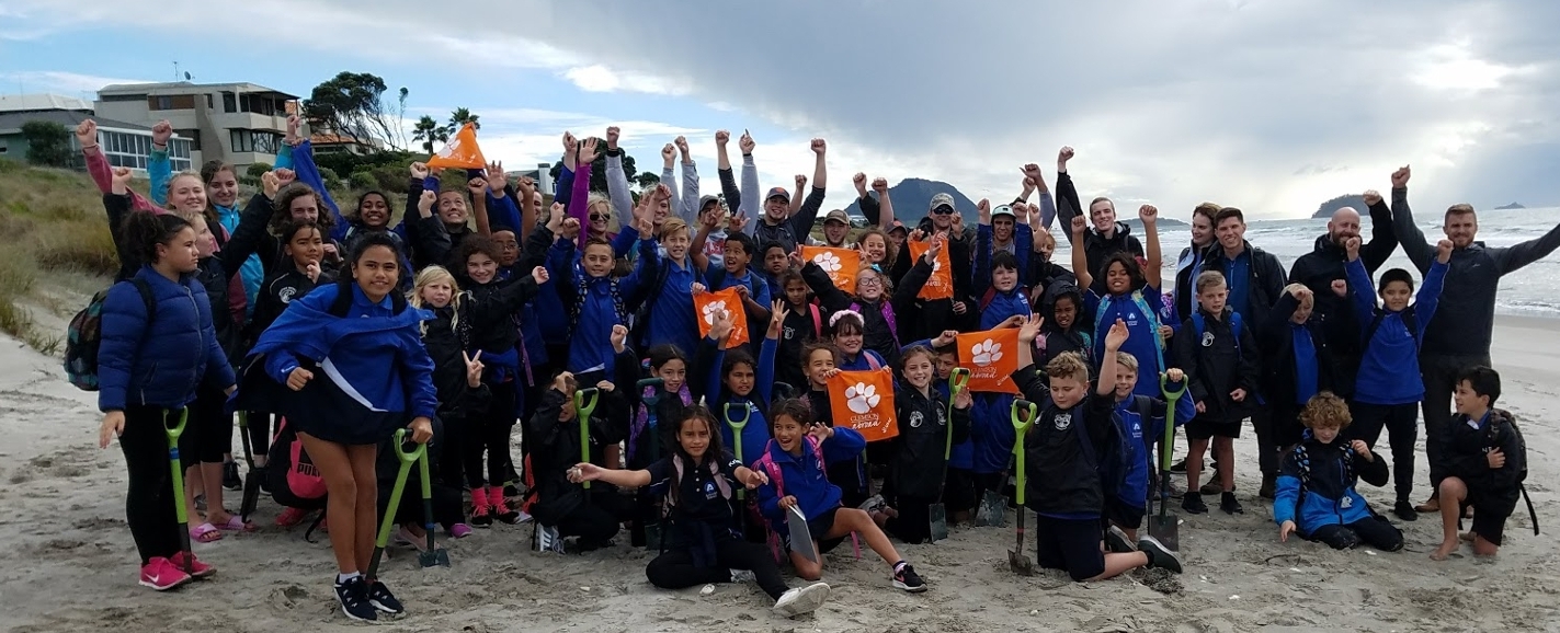 A group of Clemson students pose at Maori Beach