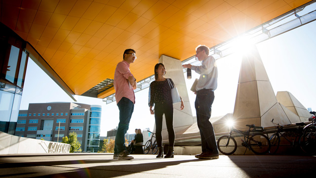 researchers chat outside