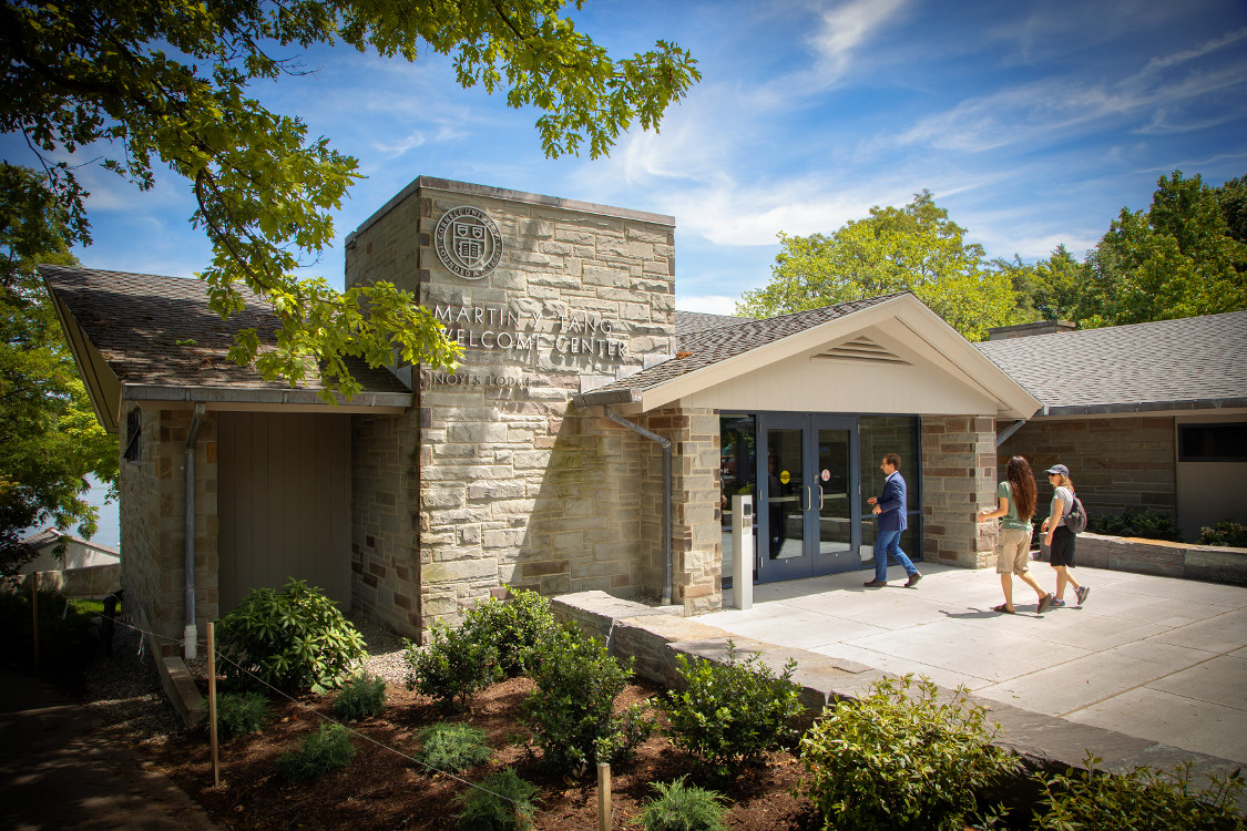 Students walking into the Martin Y. Tang Welcome Center