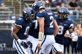 The UConn football team cruised past several school records on its way to a dominant 63-17 win over Merrimack, an FCS opponent, for its first victory of the year.