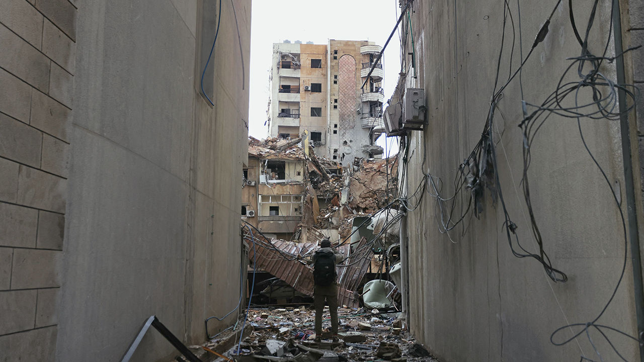 A man inspects the damage at the site of an overnight Israeli airstrike that targeted the Shayyah neighborhood in Beirut's southern suburbs on November 26, 2024