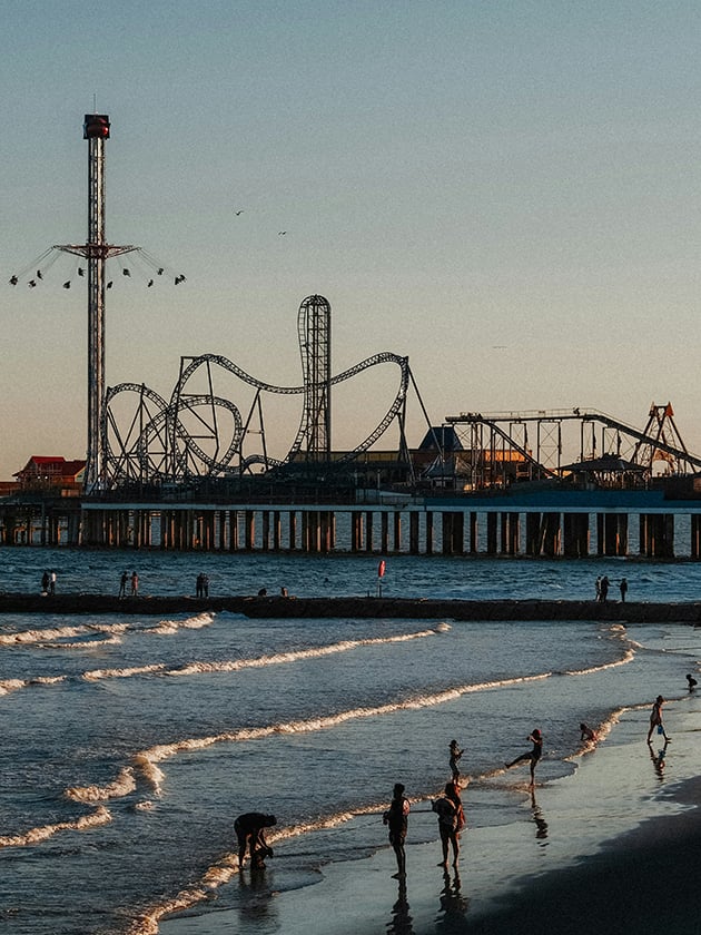 A view of an amusement park at a Galveston Island beach in Texas, USA near ELS Houston.