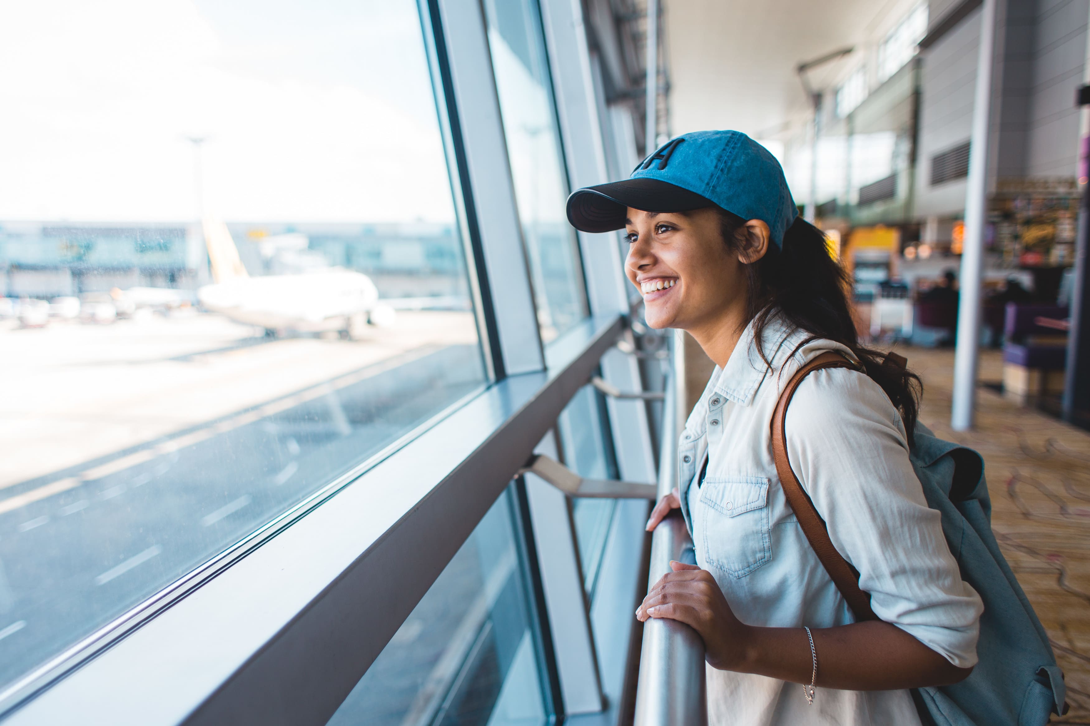 young-woman-excited-and-waiting-her-trip-at-the-ai-2022-11-10-17-55-12-utc