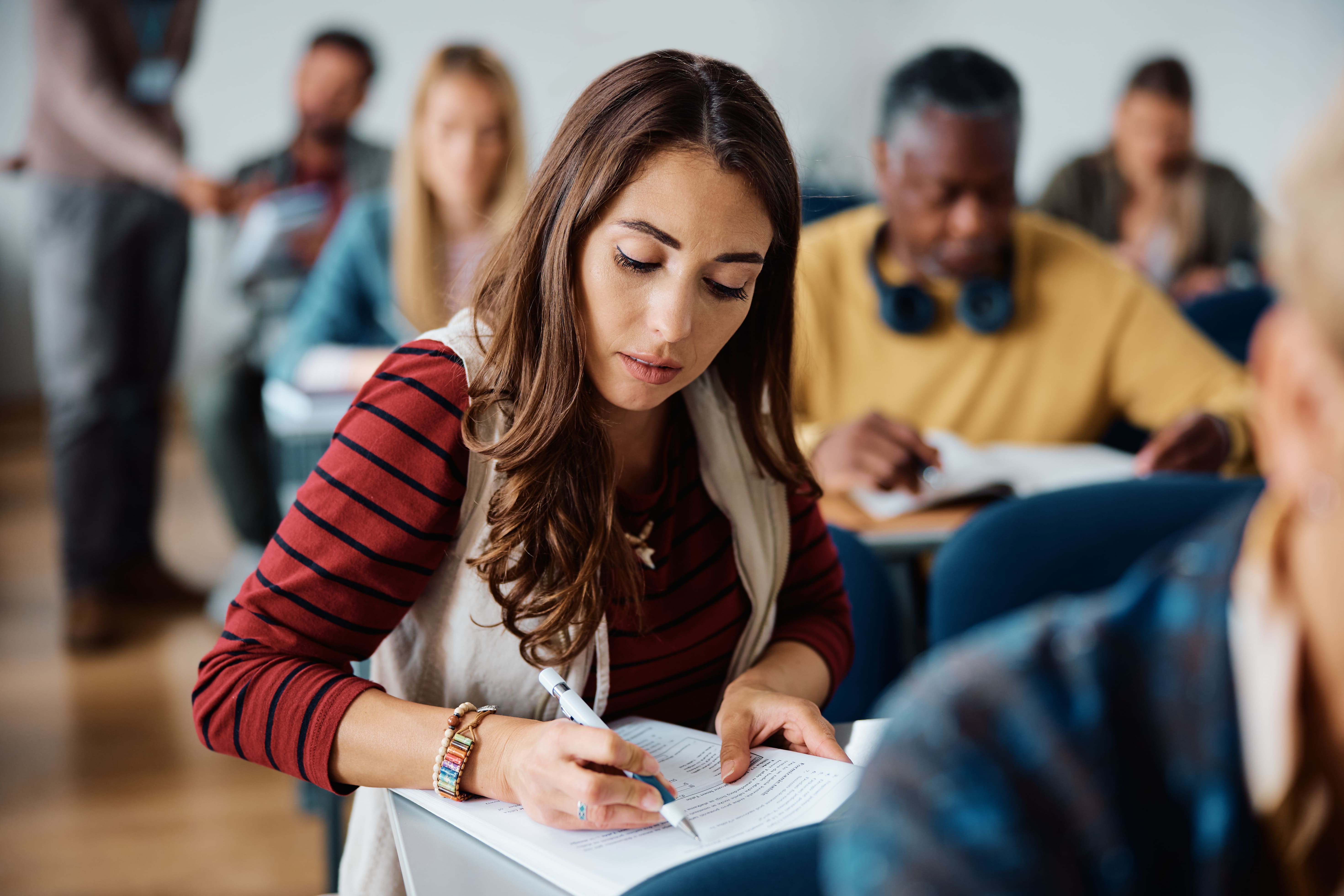 young-woman-learning-while-attending-adult-educati-2023-11-27-04-50-31-utc