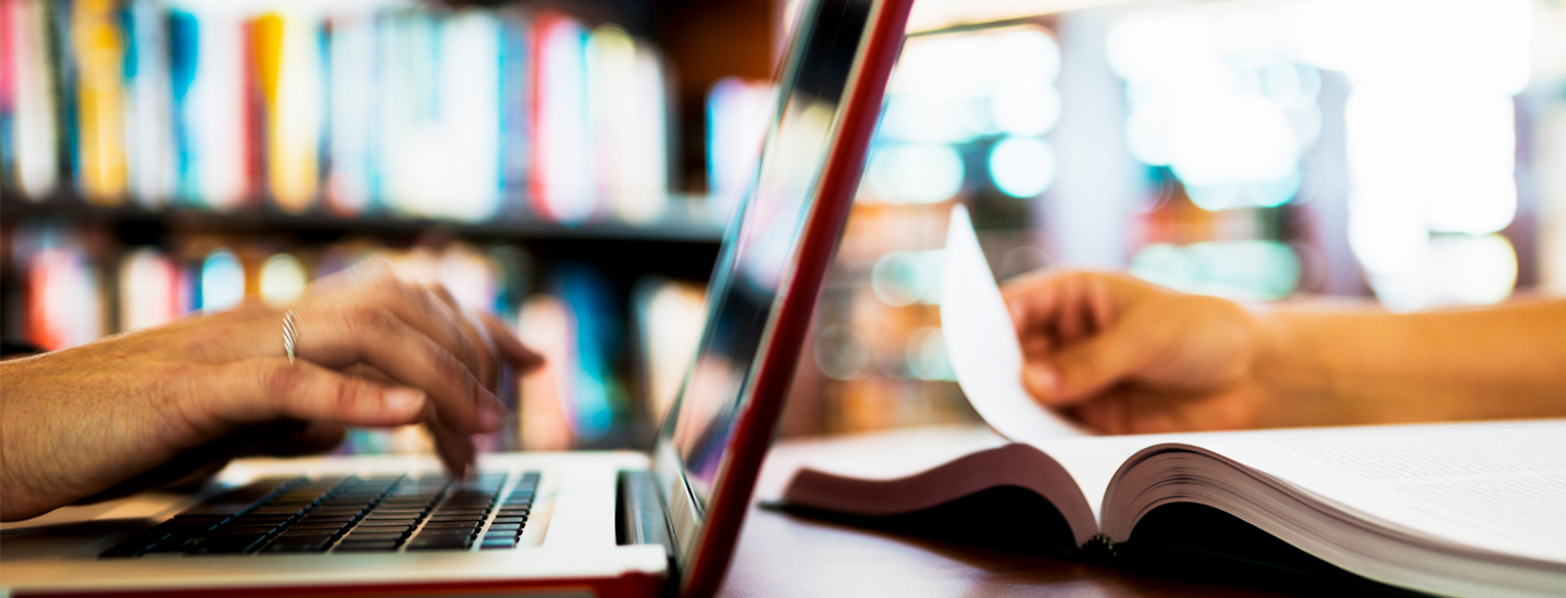 Man on Laptop and Woman reading book