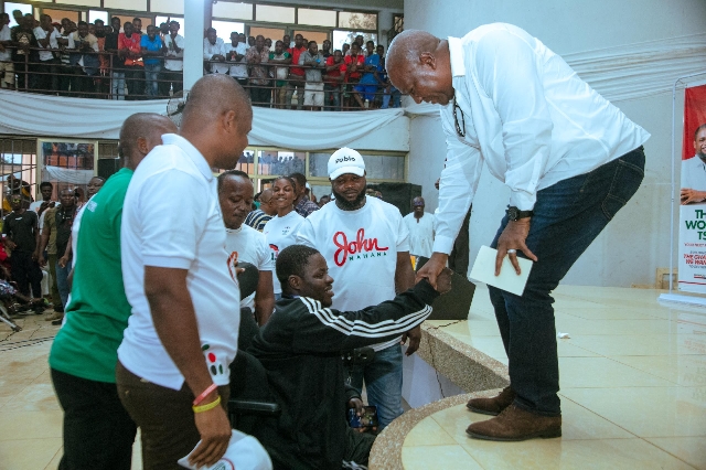 NDC central youth wing presents electronic wheelchair to party faithful Elijah Akoto –