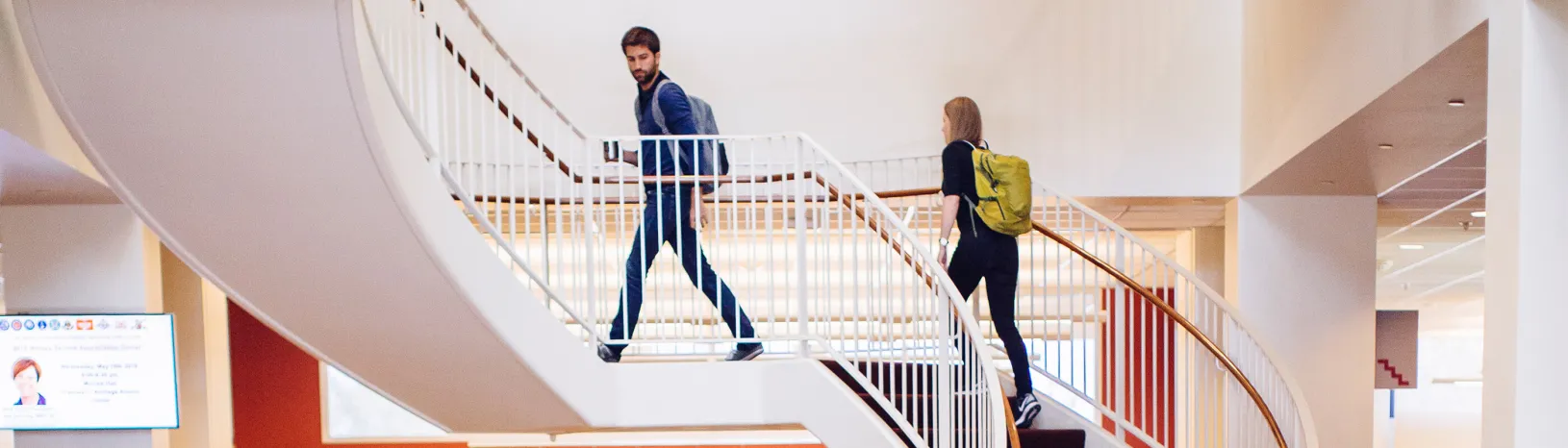 MSx students walking up the stairs in the Bass Center