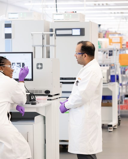 USA lab wide shot of two people working in lab